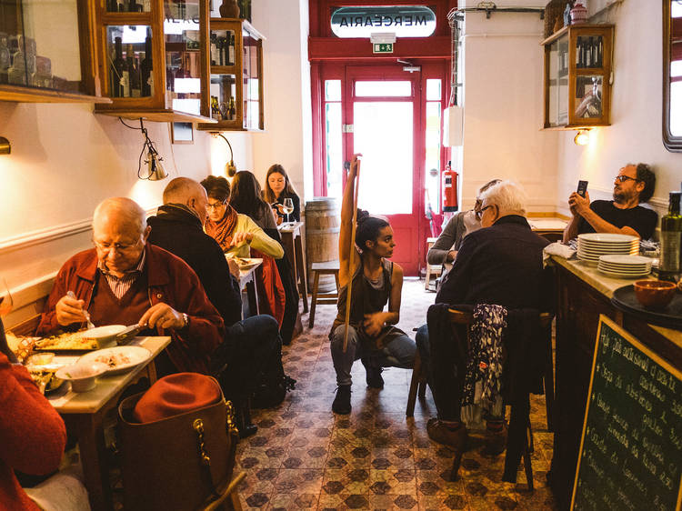 Wait in line for an incredible dinner at Taberna da Rua das Flores